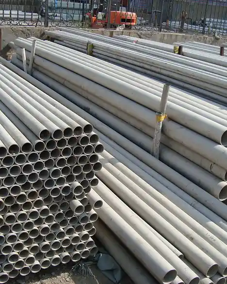 Stainless steel pipe stacked in bundles at a stockyard