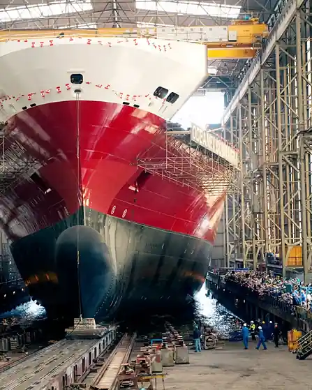 Ship under construction in a covered shipbuilding dock
